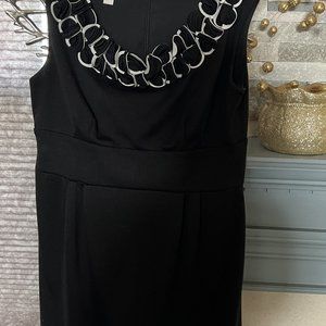Little Black dress with frillies around the collar
